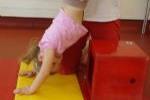 Young Girl Learning to Headstand